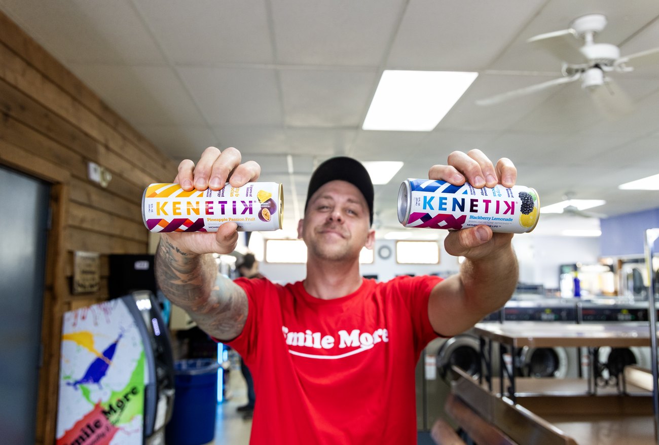 Roman Atwood holding two Kenetik cans